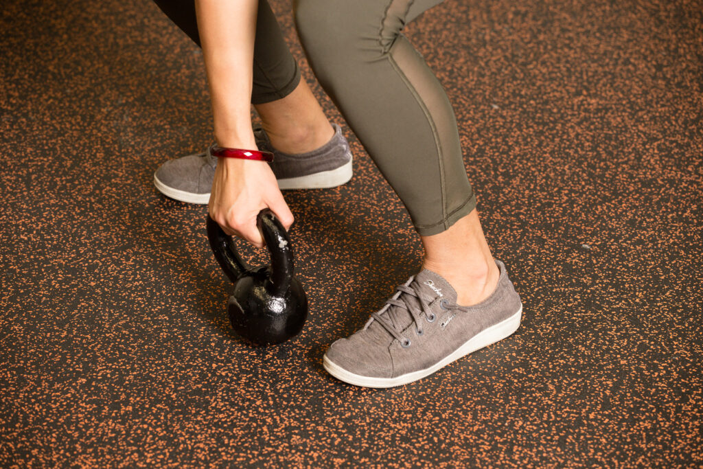 Using a kettlebell at the gym